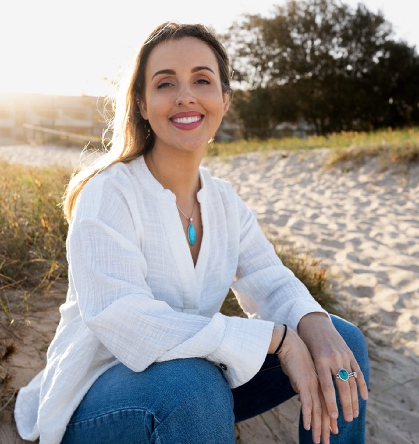 Meghan Brazh - Holistic Counsellor and Psychological Astrology Practitioner on Gold Coast beach at sunset