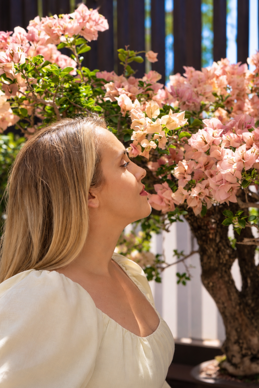 Meghan of Dharma Space beside pink flowers